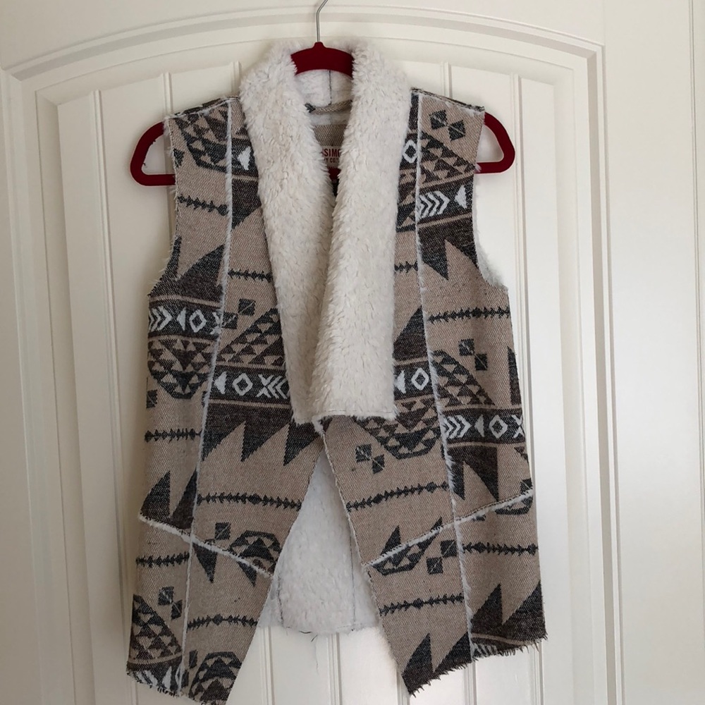 Mossino faux fur lined vest.